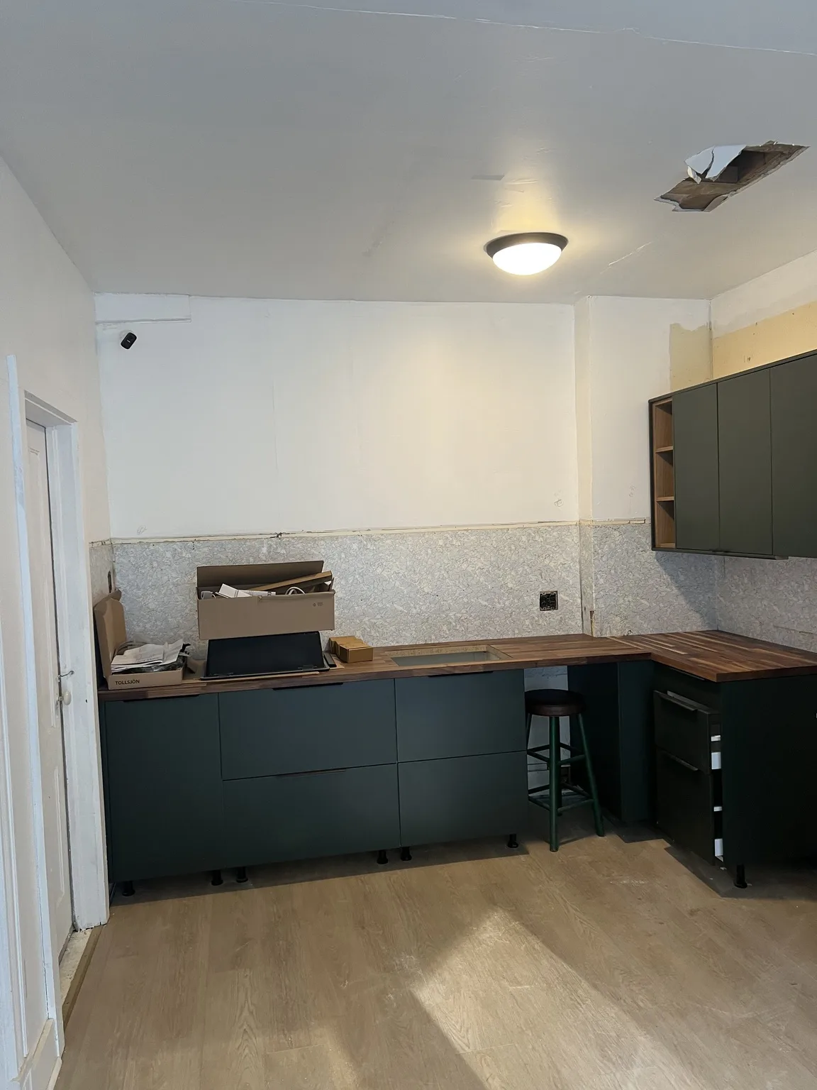 Dark Green Kitchen with Wood Accents