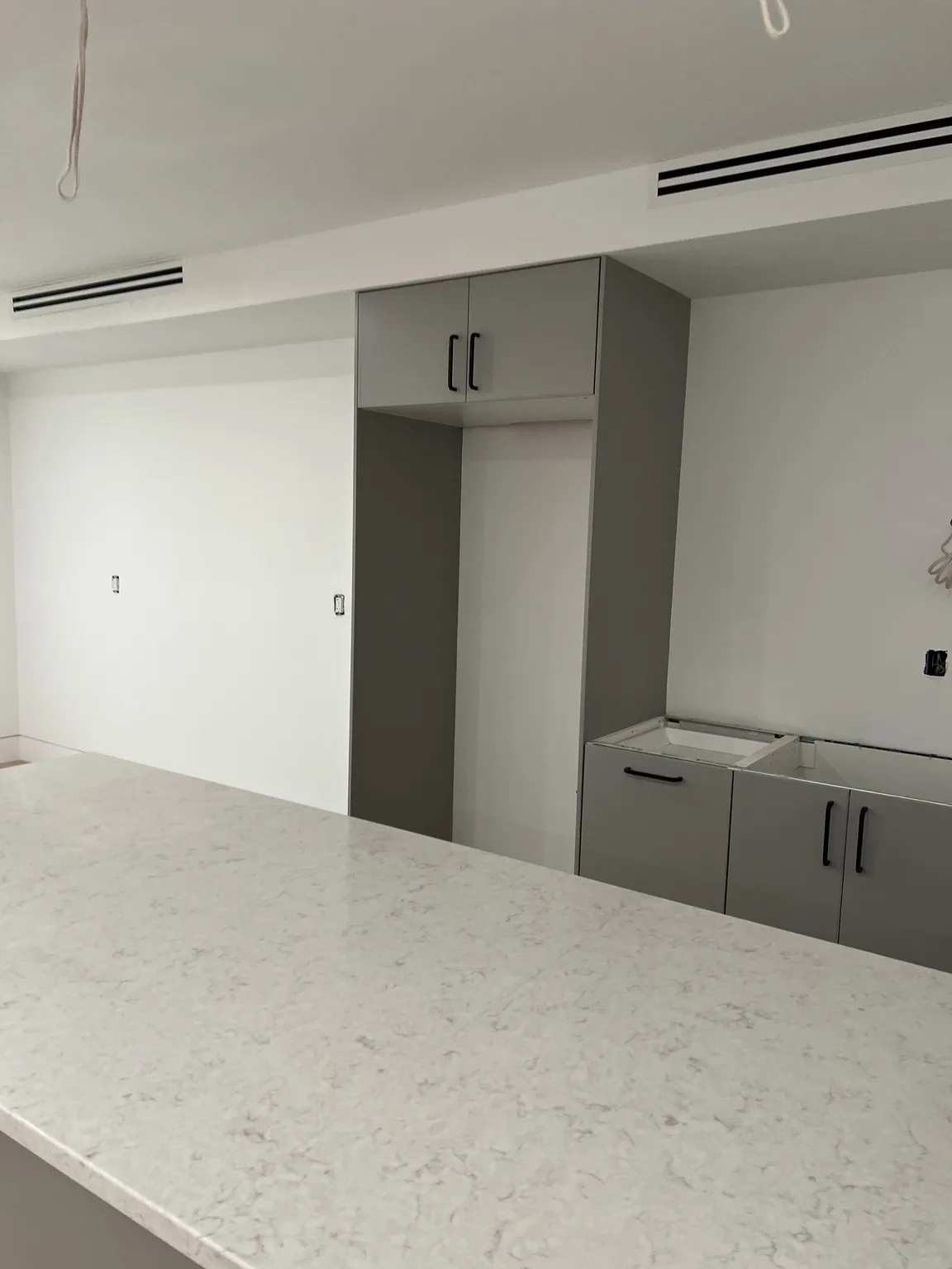 IKEA kitchen installation near Bushwick, NY — Grey Base Cabinet Installation